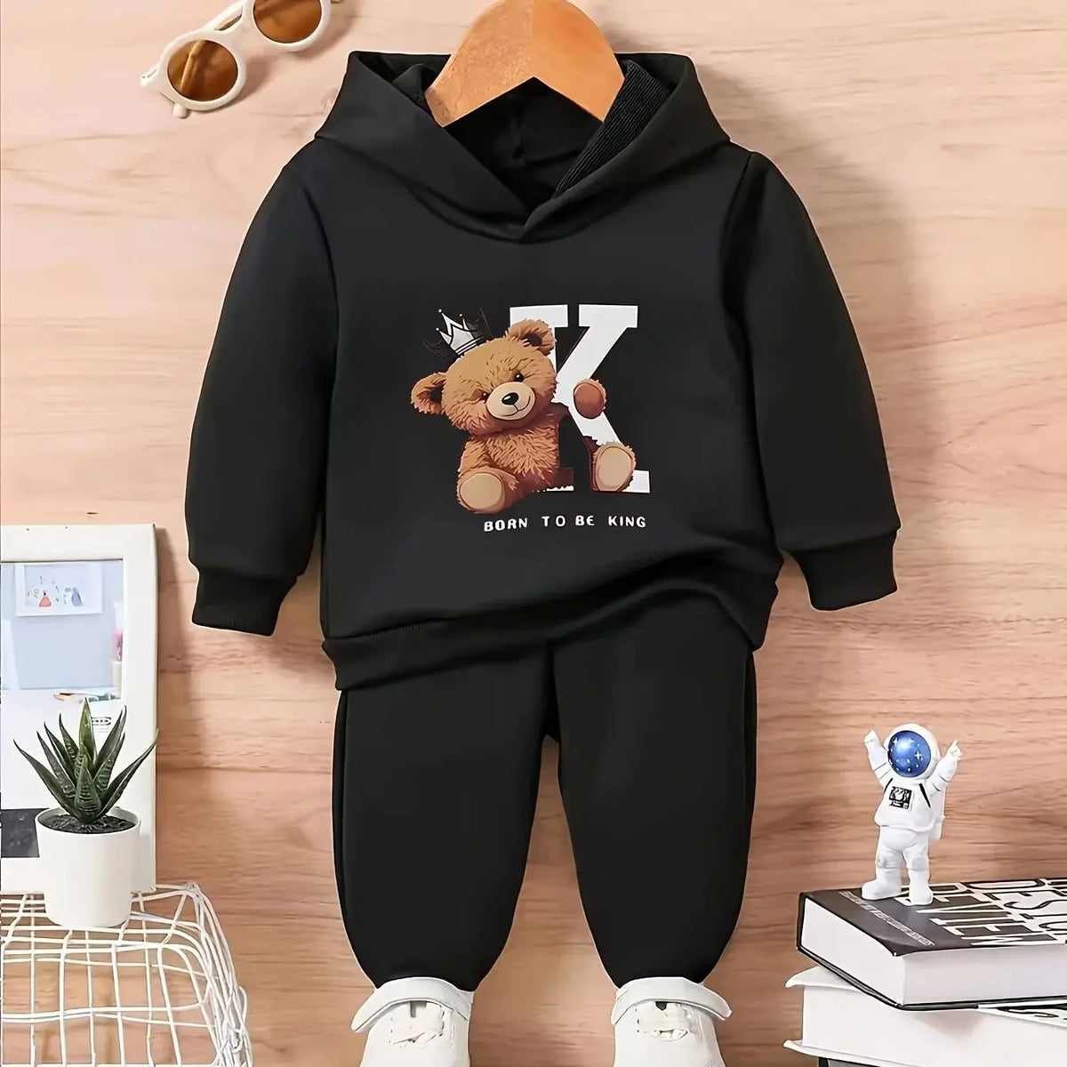 A two-piece cartoon printed fleece hoodie and long pants set for a newborn baby boy in autumn and winter