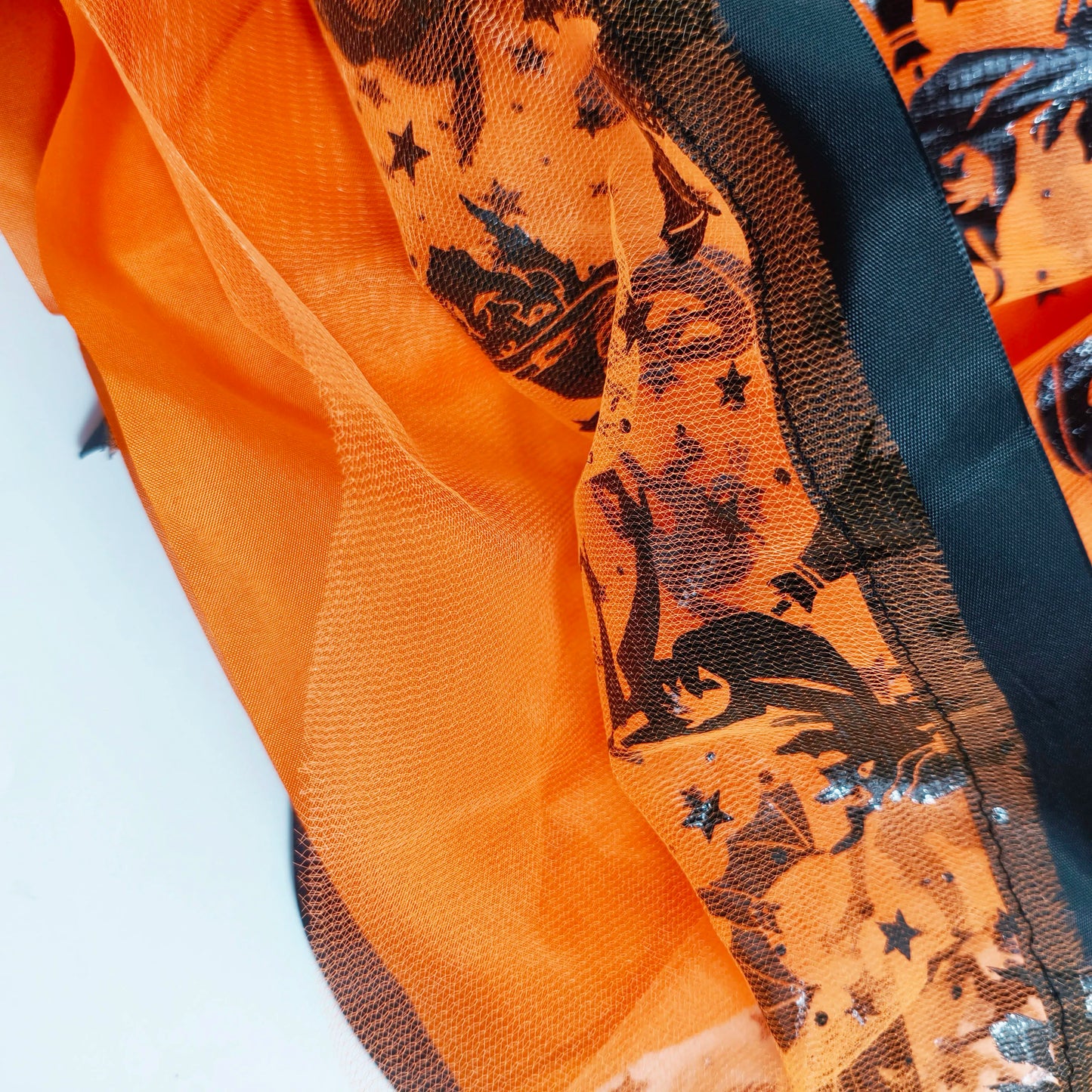 Halloween Adults Tulle Skirt Adorned with bats pumpkins stars this orange tulle skirt has a black bow waist  trim