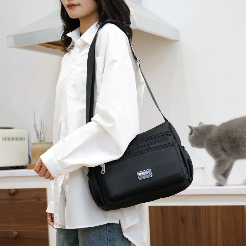 2025 Bag Women's Large Capacity Shoulder Bag Waterproof and Wear Resistant Multi Pocket Commuter Leisure Outdoor Crossbody Bag
