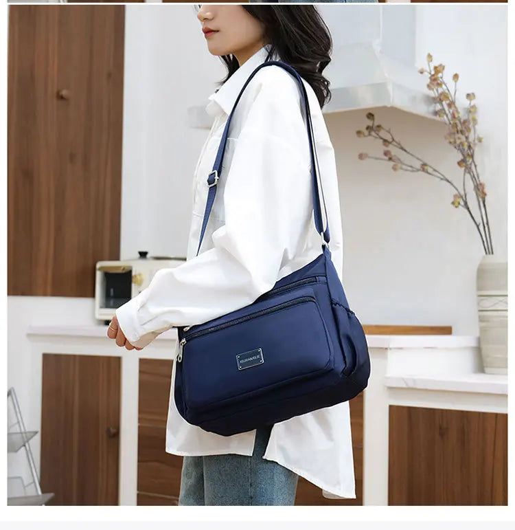 2025 Bag Women's Large Capacity Shoulder Bag Waterproof and Wear Resistant Multi Pocket Commuter Leisure Outdoor Crossbody Bag