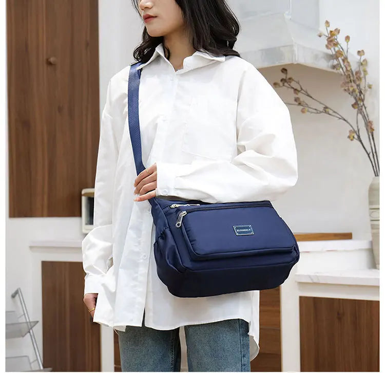 2025 Bag Women's Large Capacity Shoulder Bag Waterproof and Wear Resistant Multi Pocket Commuter Leisure Outdoor Crossbody Bag