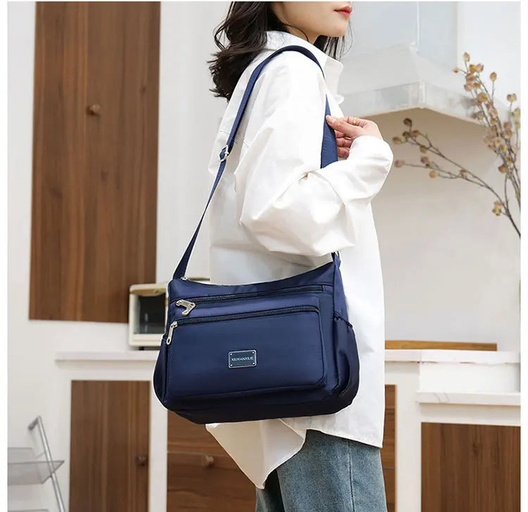 2025 Bag Women's Large Capacity Shoulder Bag Waterproof and Wear Resistant Multi Pocket Commuter Leisure Outdoor Crossbody Bag