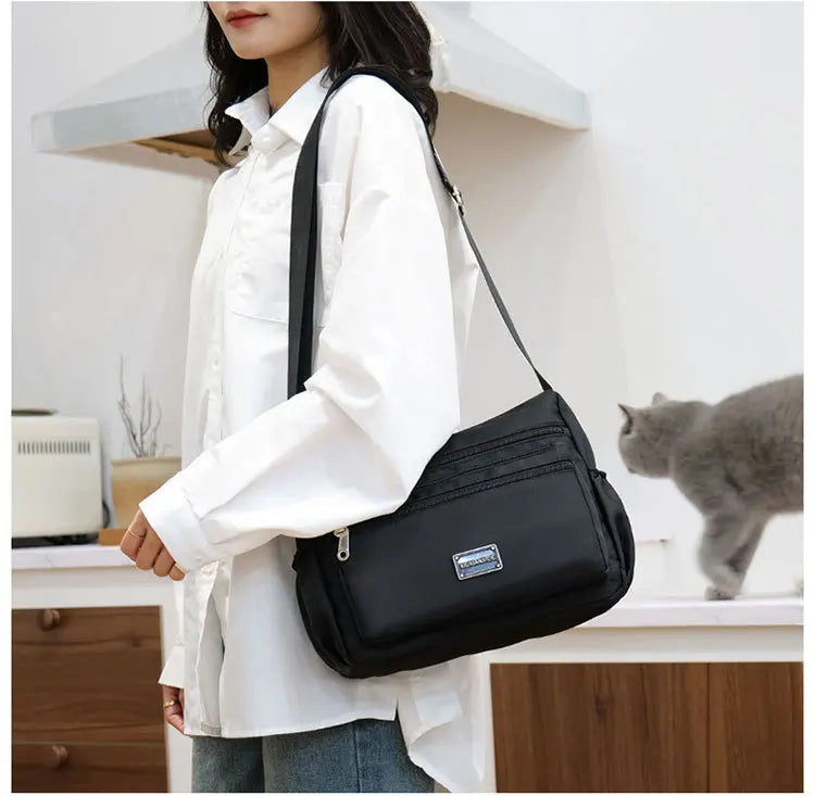 2025 Bag Women's Large Capacity Shoulder Bag Waterproof and Wear Resistant Multi Pocket Commuter Leisure Outdoor Crossbody Bag